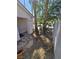 Front yard with xeriscape landscaping featuring trees, stones and some greenery at 79 Magical Mystery Ln, Henderson, NV 89074