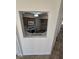 The kitchen features classic cabinetry and appliances, viewed through the living room pass-through at 79 Magical Mystery Ln, Henderson, NV 89074