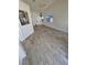 Bright and spacious living room with vaulted ceilings and wood-look tiled floors at 79 Magical Mystery Ln, Henderson, NV 89074