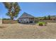 Expansive backyard featuring a hot tub, outdoor kitchen, fire pit, and gravel landscaping at 80 E Texas Ave, Henderson, NV 89015