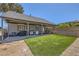 This backyard features artifical turf, covered patio, and grilling area at 80 E Texas Ave, Henderson, NV 89015