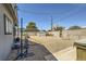 Backyard showcasing the spacious layout, outdoor fitness equipment, and hardscape at 80 E Texas Ave, Henderson, NV 89015
