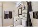 Bathroom featuring modern vanity, shower with black hardware, and gray towels at 80 E Texas Ave, Henderson, NV 89015
