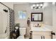 Cozy bathroom features a shower, neutral walls, and a modern vanity and mirror at 80 E Texas Ave, Henderson, NV 89015