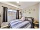 Bedroom featuring modern decor, a window, and neutral walls at 80 E Texas Ave, Henderson, NV 89015