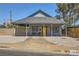 Charming single-story home featuring a welcoming front porch and desert landscaping at 80 E Texas Ave, Henderson, NV 89015