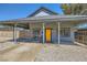 Single-story home with inviting covered porch and desert landscape at 80 E Texas Ave, Henderson, NV 89015
