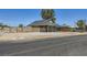 Single-story home with desert landscaping and cozy covered porch at 80 E Texas Ave, Henderson, NV 89015