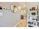 Stylish hallway featuring wood floors, and decorative wall accents, with an inviting entrance at 80 E Texas Ave, Henderson, NV 89015