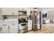 Modern kitchen featuring stainless steel appliances, including a range and microwave at 80 E Texas Ave, Henderson, NV 89015