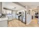 Renovated kitchen with stainless steel appliances and ample counter space, connected to the living area at 80 E Texas Ave, Henderson, NV 89015