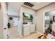 Well-organized laundry area with sleek, modern appliances, and ample shelving at 80 E Texas Ave, Henderson, NV 89015