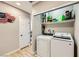 A convenient laundry room with a modern washer and dryer setup at 80 E Texas Ave, Henderson, NV 89015