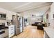 Open concept kitchen and living room area featuring stainless steel appliances and comfortable seating at 80 E Texas Ave, Henderson, NV 89015
