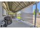 Covered patio features shielding sun shades, a barbecue, seating, and weights at 80 E Texas Ave, Henderson, NV 89015