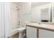 Clean bathroom features a shower-tub combo with white tiled walls, plus a modern vanity at 8600 W Charleston Blvd # 2085, Las Vegas, NV 89117