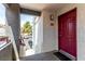Inviting entryway featuring a vibrant door, a welcoming mat, and a glimpse of the community, a warm arrival at 8600 W Charleston Blvd # 2085, Las Vegas, NV 89117