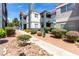 Exterior view displaying well-maintained landscaping, covered balconies and ample parking, a beautiful community setting at 8600 W Charleston Blvd # 2085, Las Vegas, NV 89117