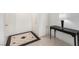 Elegant foyer showcasing stylish tile flooring and a contemporary console table, creating a sophisticated entry at 8600 W Charleston Blvd # 2085, Las Vegas, NV 89117