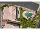 Stunning aerial view of a home with a private pool, lush landscaping, and a spacious backyard at 8970 Lansberry Ct, Las Vegas, NV 89147