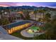 Beautiful aerial view showing the home, spacious backyard with pool, and mountain backdrop at 8970 Lansberry Ct, Las Vegas, NV 89147