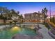 Stunning backyard view showcasing the pool, landscaping, and the two-story home at 8970 Lansberry Ct, Las Vegas, NV 89147