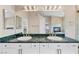 Bathroom featuring double sinks, vanity, and large mirror at 8970 Lansberry Ct, Las Vegas, NV 89147