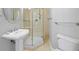 Bathroom with stand up shower, toilet, and pedestal sink at 8970 Lansberry Ct, Las Vegas, NV 89147
