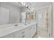 A well-lit bathroom with double sinks and a separate toilet and shower area at 8970 Lansberry Ct, Las Vegas, NV 89147