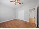 A bedroom featuring laminate floors and access to a closet and the main level at 8970 Lansberry Ct, Las Vegas, NV 89147