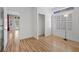 Bedroom with wood floors, closet, plantation shutters, and interior entrance to back yard at 8970 Lansberry Ct, Las Vegas, NV 89147