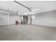 Spacious garage with concrete floors, overhead lighting, and work bench at 8970 Lansberry Ct, Las Vegas, NV 89147