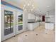 Gourmet kitchen with white cabinets and granite countertops, and a view to the backyard at 8970 Lansberry Ct, Las Vegas, NV 89147