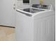 Modern white washing machine with digital display in a well-lit laundry area at 8970 Lansberry Ct, Las Vegas, NV 89147