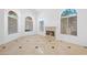 Bright living room with high ceilings, a fireplace, and elegant tile flooring at 8970 Lansberry Ct, Las Vegas, NV 89147