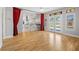 Open concept living room featuring light hardwood floors and view of the kitchen at 8970 Lansberry Ct, Las Vegas, NV 89147