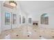 Spacious living room with high ceilings, a fireplace, and large windows at 8970 Lansberry Ct, Las Vegas, NV 89147