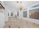 Bright and expansive open-concept living area with fireplace, large windows, and tile flooring at 8970 Lansberry Ct, Las Vegas, NV 89147