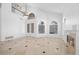 Spacious living room with high ceilings, a fireplace, and large windows at 8970 Lansberry Ct, Las Vegas, NV 89147