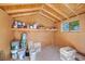 Inside shed with shelves filled with paints, topped with a clean window and wood ceiling at 8970 Lansberry Ct, Las Vegas, NV 89147