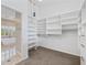 Spacious walk-in closet with custom shelving and organization systems at 8970 Lansberry Ct, Las Vegas, NV 89147