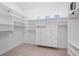 Large walk-in closet with adjustable shelving and ample storage space at 8970 Lansberry Ct, Las Vegas, NV 89147