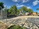 The fenced community basketball court provides a recreational space for residents to enjoy at 9116 Tailor Made Ave, Las Vegas, NV 89149