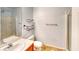 A well-lit bathroom features a single sink vanity and a walk-in shower with glass door at 9116 Tailor Made Ave, Las Vegas, NV 89149