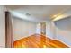 Bright bedroom with hardwood floors, recessed lights, and a barn door leading to a closet for organized storage at 9116 Tailor Made Ave, Las Vegas, NV 89149