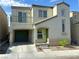 Charming two-story home featuring stucco siding, a small balcony, and an attached garage at 9116 Tailor Made Ave, Las Vegas, NV 89149