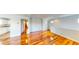 Hardwood floors upstairs lead into a bright kitchen with white cabinetry at 9116 Tailor Made Ave, Las Vegas, NV 89149
