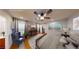 The primary bedroom offers hardwood floors, a ceiling fan, and bright natural light at 9116 Tailor Made Ave, Las Vegas, NV 89149