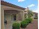 Charming covered back patio with lush landscaping, ideal for outdoor relaxation and privacy at 9329 Fresh Spring Dr, Las Vegas, NV 89134