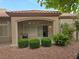 Outdoor patio space with a red tile roof and desert landscaping at 9329 Fresh Spring Dr, Las Vegas, NV 89134